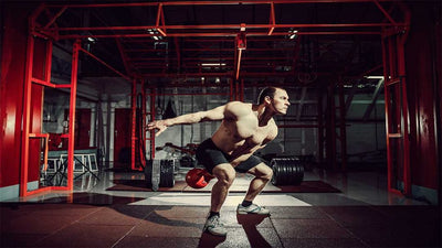 Breaking Down Strongman Exercises: The Dumbbell Swing