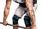 black-cyan knee wraps protects during deadlift