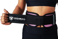 pink model putting on back support lifting belt