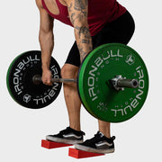 Weight lifter using silicon squat wedges for a better deadlift form