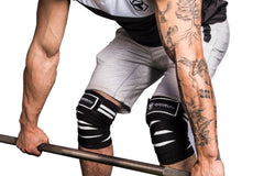 black-white knee wraps protects during deadlift