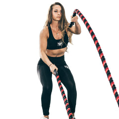 all woman using battle rope for cardio